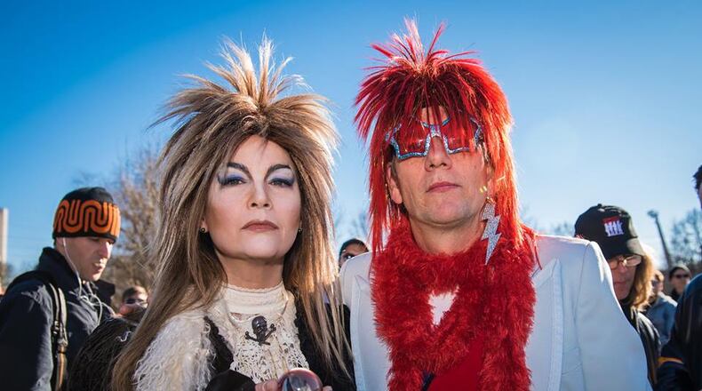 Two David Bowie fans donned full regalia for an impromptu parade Sunday in honor of the late rock star. Photo: Steve Eberhardt