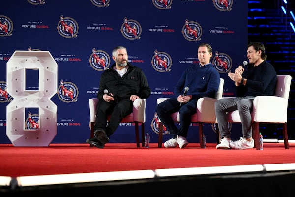 From left, Washington Capitals' Alex Ovechkin, Nicklas Backstrom and T.J. Oshie take part in the GR8 city celebration to honor Ovechkin for scoring 895 NHL career goals, Friday, April 11, 2025, in Washington. (AP Photo/Nick Wass)
