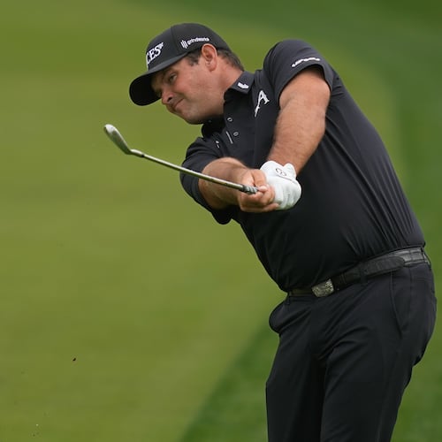 Patrick Reed of the United States plays his second shot on the 8th hole during the final round of the Dubai Desert Classic in United Arab Emirates, Sunday, Jan. 25, 2026. (AP Photo/Altaf Qadri)