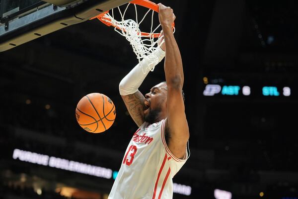 Houston's J'Wan Roberts dunks during the first half in the Sweet 16 of the NCAA college basketball tournament against Purdue Friday, March 28, 2025, in Indianapolis. (AP Photo/Michael Conroy)