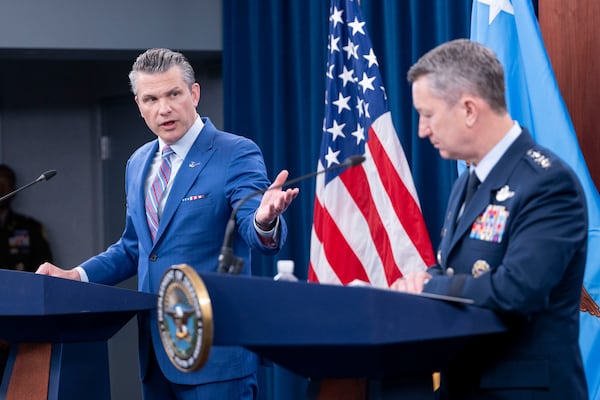 Defense Secretary Pete Hegseth, left, speaks at a news conference with Joint Chiefs Chairman Gen. Dan Caine at the Pentagon, Thursday, June 26, 2025 in Washington. (AP Photo/Kevin Wolf)