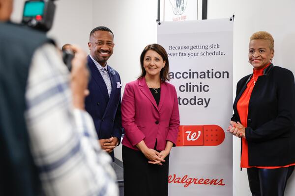 In this file photo, (Left to right) Morris Brown College president Kevin James, CDC Director Dr. Mandy Cohen and Conference of National Black Churches president Jacqui Burton take a photo during a tour of a vaccine clinic hosted by the Conference of National Black Churches on Tuesday, Oct. 10, 2023. (Natrice Miller/ Natrice.miller@ajc.com)