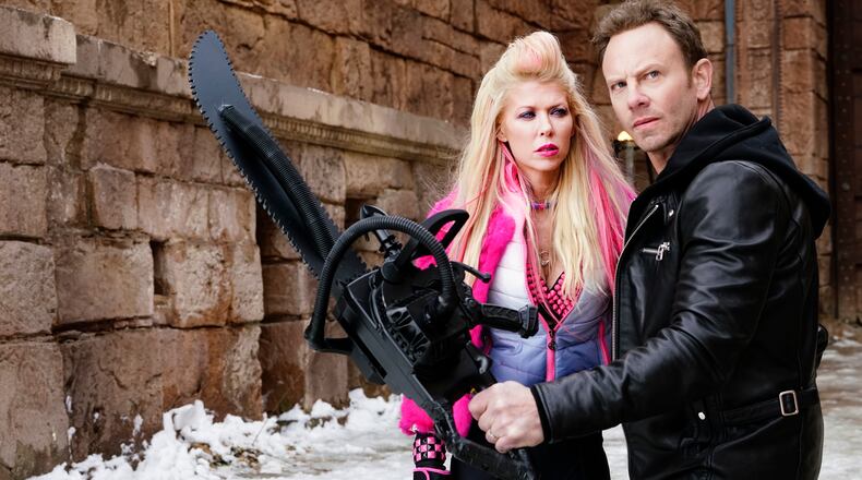 SHARKNADO 5: GLOBAL SWARMING -- Pictured: (l-r) Tara Reid as April Shepard, Ian Ziering as Fin Shepard -- (Photo by: Yana Blajeva/Syfy)