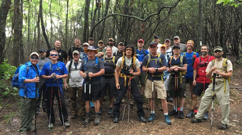 Five blinded American veterans and two British veterans pose with about 20 volunteer sight guides June 1 prior to beginning their 74-mile hike on the Appalachian Trail. CONTRIBUTED BY FRANK REDDY