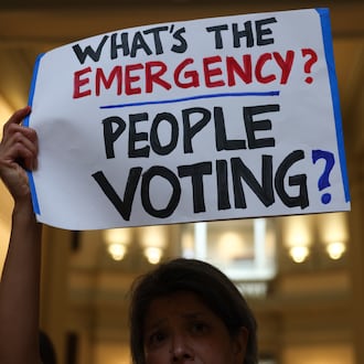 Activists opposed to redistricting, including Marjorie Pak, gather at a press conference before the state legislature convenes for a special session in Atlanta on June 17, 2026. After Georgia Republican leaders announced that they wouldn’t redraw the state’s political maps during the session, state Sen. Max Burns, R-Sylvania, introduced legislation to delay an implementation date to end counting votes with QR codes. (Arvin Temkar/AJC)