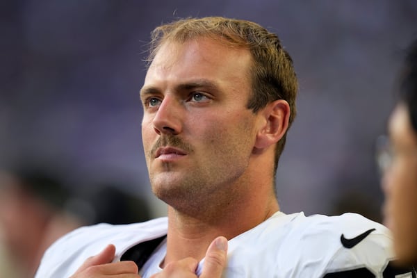 Las Vegas Raiders tight end Brock Bowers watches from the sideline during the second half of an NFL preseason football game against the Minnesota Vikings, Saturday, Aug. 10, 2024, in Minneapolis. (AP Photo/Charlie Neibergall)