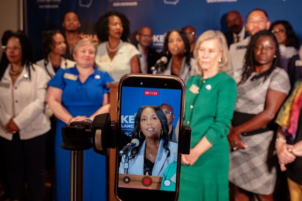 Keisha Lance Bottoms is joined by Georgia legislators as she unveils her ethics and government transparency plan in Atlanta on Thursday. (Ben Gray for the AJC)