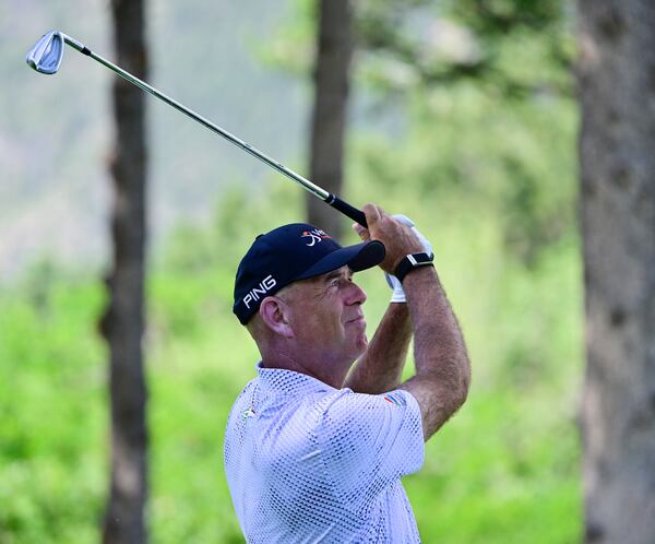 Stewart Cink follows the flight of his shot off the 16th hole tee box during the second round of the U.S. Senior Open Championship golf tournament at Broadmoor Golf Club, Friday, June 27, 2025, in Colorado Springs, Colo. (Andy Cross/The Denver Post via AP)