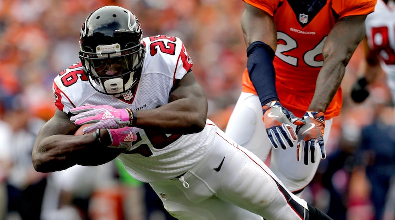 Atlanta Falcons running back Tevin Coleman (26) dives into the end zone for a touchdown against the Denver Broncos during the second half of an NFL football game, Sunday, Oct. 9, 2016, in Denver. (AP Photo/Joe Mahoney)