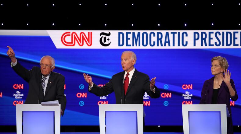 WESTERVILLE, OHIO - OCTOBER 15: (L-R) Sen. Bernie Sanders (I-VT), former Vice President Joe Biden, and Sen. Elizabeth Warren (D-MA) react during the Democratic Presidential Debate at Otterbein University on October 15, 2019 in Westerville, Ohio. A record 12 presidential hopefuls are participating in the debate hosted by CNN and The New York Times. (Photo by Win McNamee/Getty Images)