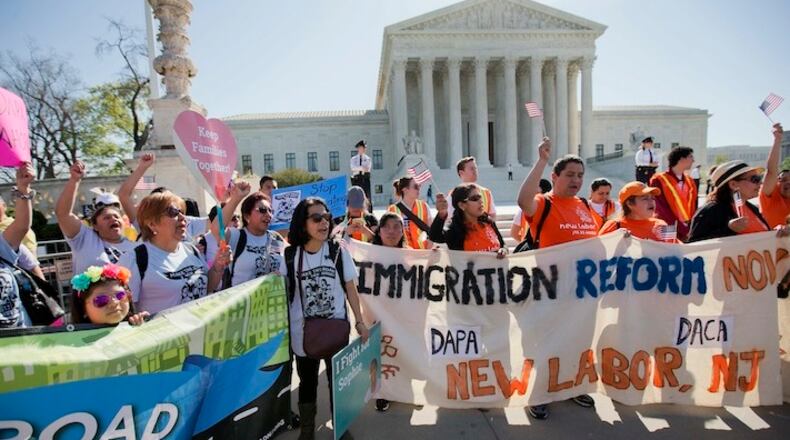 Supporters of fair immigration reform gather in front of the Supreme Court in Washington, Monday, April 18, 2016. The Supreme Court is taking up an important dispute over immigration that could affect millions of people who are living in the country illegally. The Obama administration is asking the justices in arguments today to allow it to put in place two programs that could shield roughly 4 million people from deportation and make them eligible to work in the United States. (AP Photo/Pablo Martinez Monsivais)