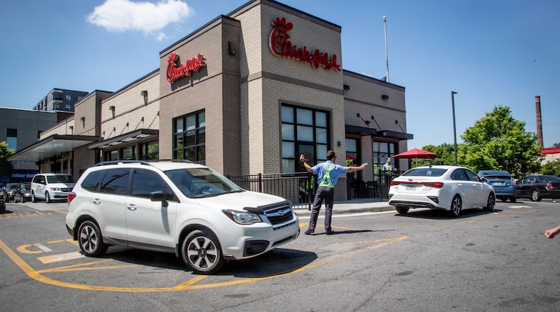 Chick-fil-A does a booming business with its drive-thrus, such as this one on Northside Drive in Atlanta. But the Atlanta-based restaurant chain is launching a concept for stand-alone delivery kitchens. The new operations, to be called Little Blue Menu, won't have dining rooms or drive-thrus. STEVE SCHAEFER FOR THE ATLANTA JOURNAL-CONSTITUTION
