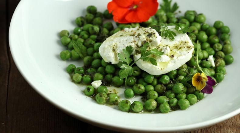 A plate of fresh peas and goat cheese provides simple, easy pleasure. (E. Jason Wambsgans/Chicago Tribune/TNS)