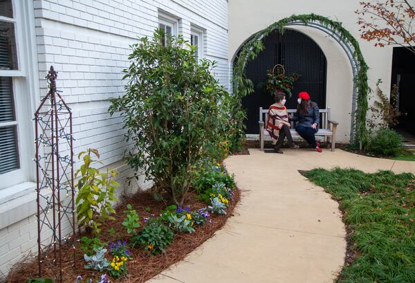 Virginia Almand (left) and Linda Gruskin chat while sitting in the  Sarahs' Garden. The garden was created for members of the RCA, who have Alzheimer's or other types of dementia. PHIL SKINNER FOR THE ATLANTA JOURNAL-CONSTITUTION.