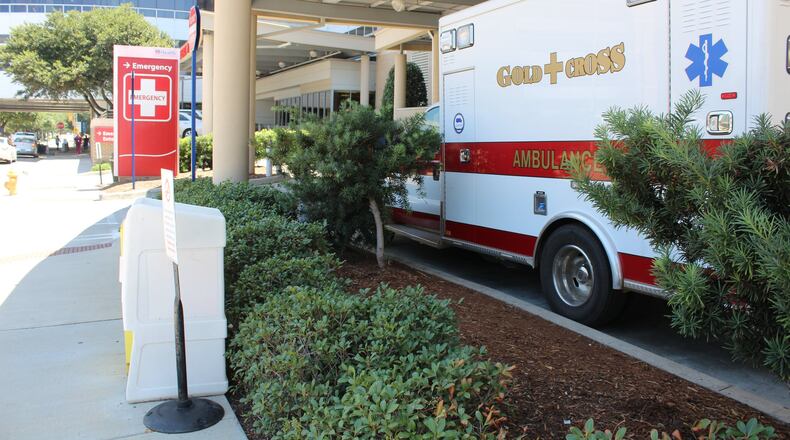 A Gold Cross ambulance waits outside of the emergency room at Augusta University Medical Center. In 2020, Augusta University Medical was forced to refund $2.6M in false claims to government funded healthcare programs. FILE PHOTO
