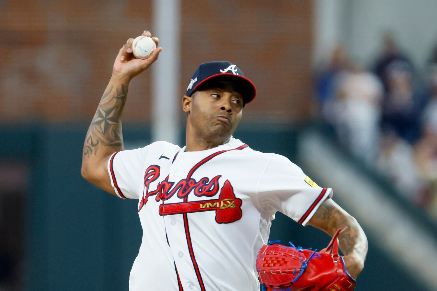 Atlanta Braves relief pitcher Raisel Iglesias (26) delivers to the Philadelphia Phillies during the ninth inning of NLDS Game 2 in Atlanta on Monday, Oct. 9, 2023.   (Miguel Martinez / Miguel.Martinezjimenez@ajc.com)