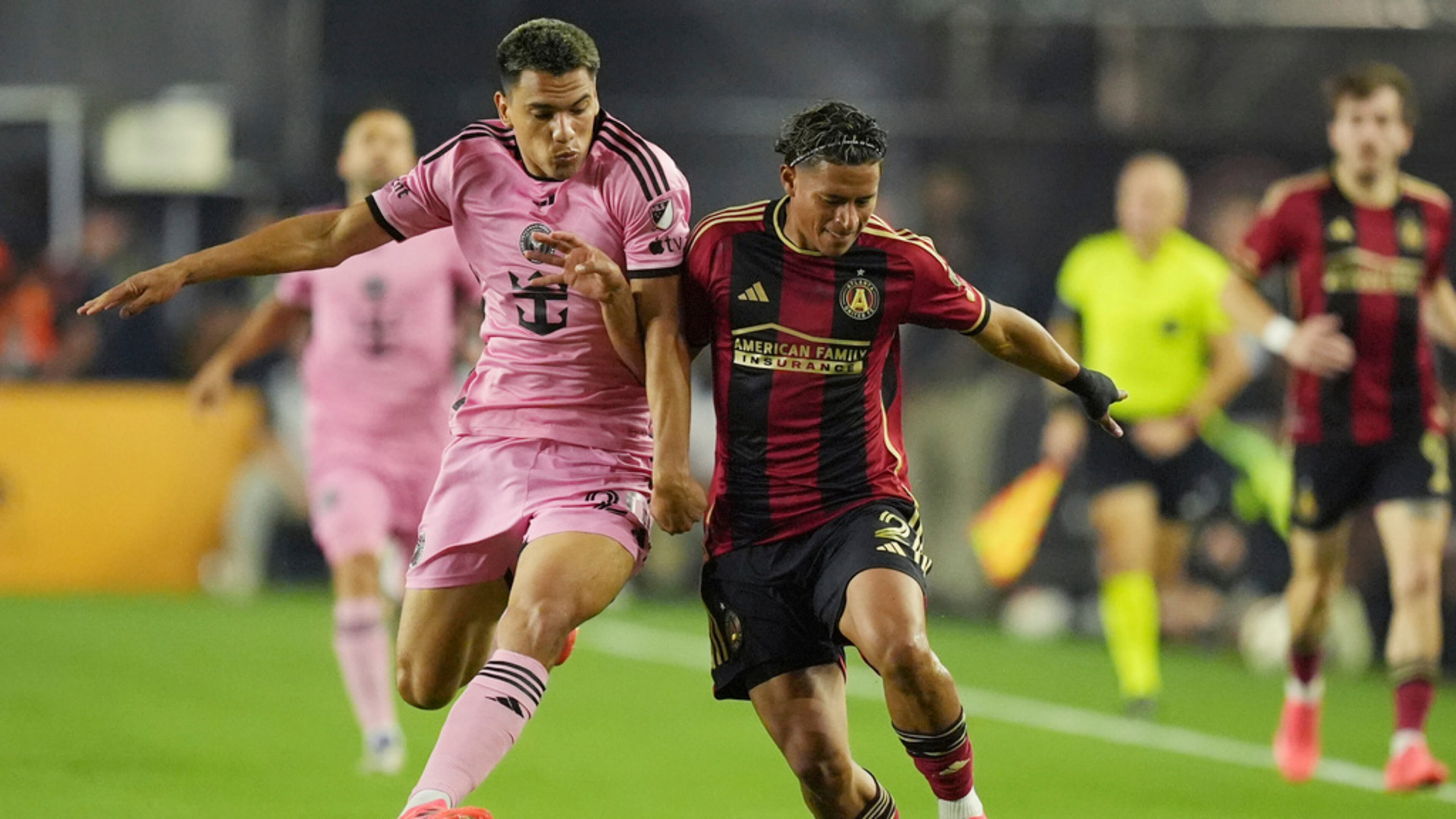 Inter Miami midfielder Diego Gómez (20) and Atlanta United defender Ronald Hernández (2) go after the ball during the first half of their MLS playoff opening round soccer match, Saturday, Nov. 9, 2024, in Fort Lauderdale, Fla. (Rebecca Blackwell/AP)