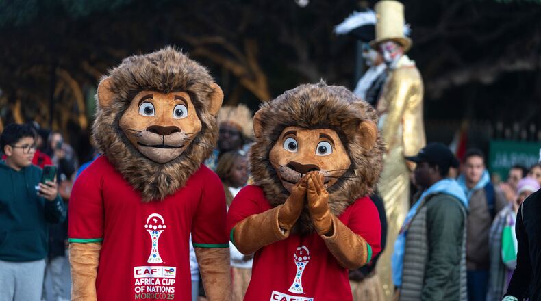 People dressed as mascots take part in a parade celebrating the upcoming Africa Cup of Nations soccer competition, in Rabat, Morocco, Saturday, Dec. 20, 2025. (AP Photo/Mosa'ab Elshamy)