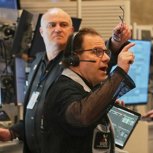 Options trader Anthony Spina, foreground, works on the floor of the New York Stock Exchange, Thursday, April 30, 2026. (AP Photo/Richard Drew)