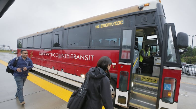 Commuters board Gwinnett County Transit express buses departing for downtown Atlanta at the Express Bus Park and Ride lot at Sugarloaf Mills in Lawrenceville. BOB ANDRES /BANDRES@AJC.COM AJC FILE PHOTO