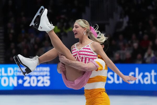 Piper Gilles and Paul Poirier, of Canada, perform during the ice dance rhythm dance program at the figure skating world championships, Friday, March 28, 2025, in Boston. (AP Photo/Charles Krupa)