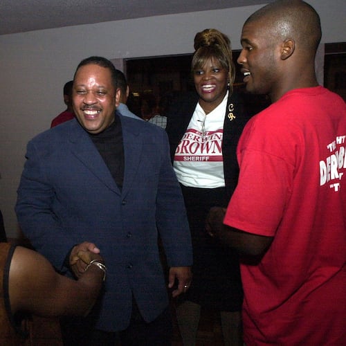 DeKalb County Sheriff-elect Derwin Brown, pictured here with well-wishers at his election victory party in August 2000, was murdered two weeks before taking office on the orders of outgoing Sheriff Sidney Dorsey. (Kent D. Johnson/AJC)