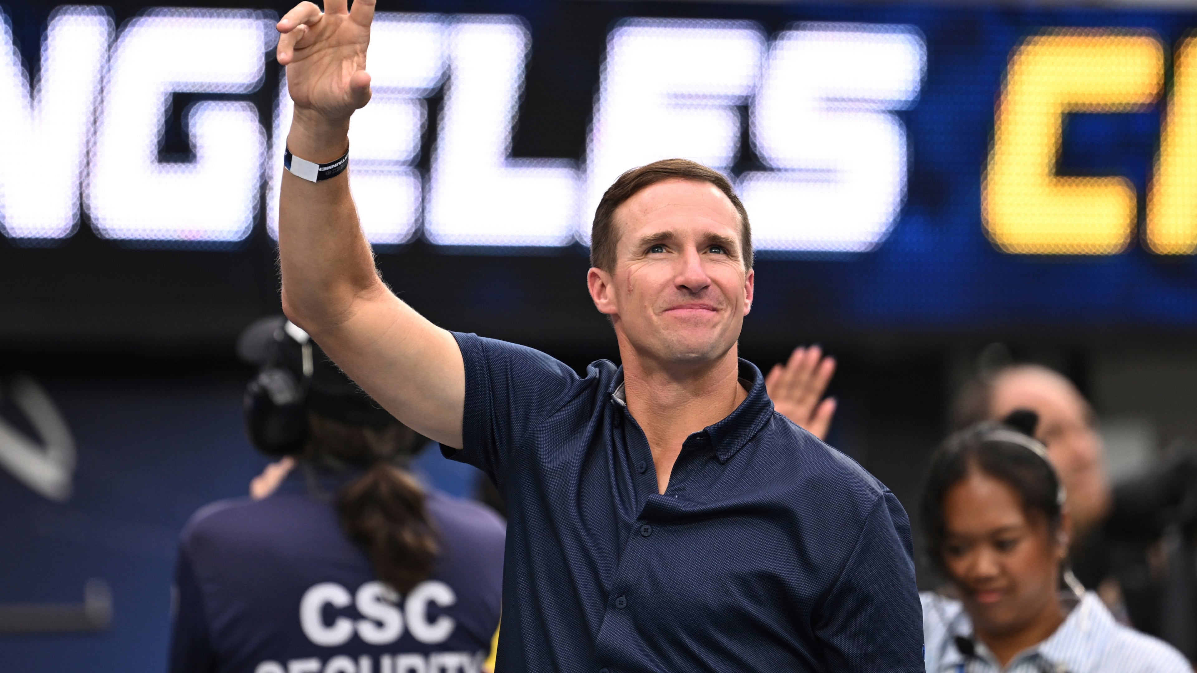 FILE - Former quarterbackDrew Brees waves to the crowd during the first half of an NFL football game between the Los Angeles Chargers and the Denver Broncos, Sunday, Sept. 21, 2025, in Inglewood, Calif. (AP Photo/Carrie Giordano, File)