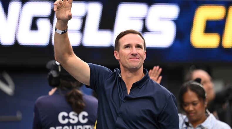 FILE - Former quarterbackDrew Brees waves to the crowd during the first half of an NFL football game between the Los Angeles Chargers and the Denver Broncos, Sunday, Sept. 21, 2025, in Inglewood, Calif. (AP Photo/Carrie Giordano, File)