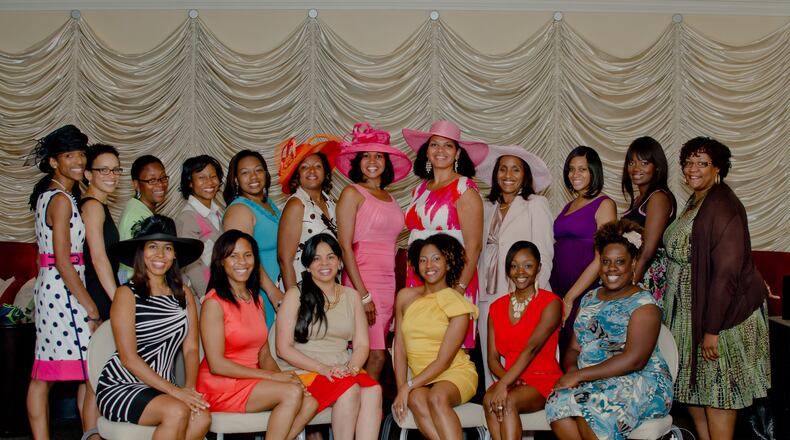 Atlanta Mocha Moms pose for a photo at their annual tea in 2014. The national organization is celebrating its 20 year anniversary. The Atlanta Chapter was created in 2004. Photo credit: Tiffany Powell Photography