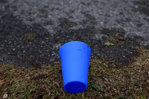 A used Hiccup, a reusable silicone cup, is discarded on the ground before being collected during the PNC Women Run the Cities race on Saturday, May 17, 2025, in Minneapolis. (AP Photo/Ellen Schmidt)