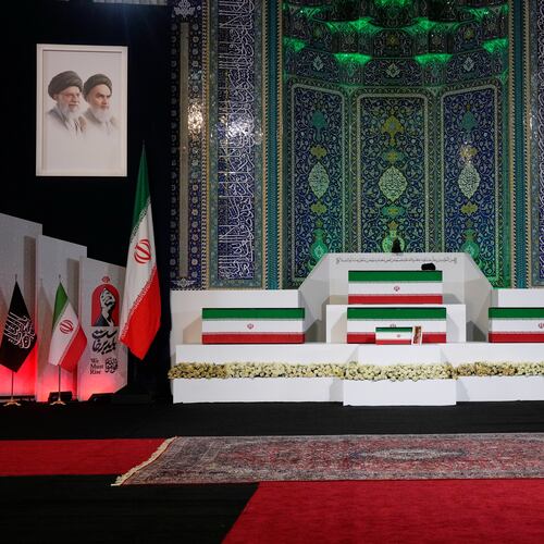 The coffins of slain Iranian Supreme Leader Ayatollah Ali Khamenei, center on top, and members of his family are displayed ahead of the dayslong funeral ceremonies at the Imam Khomeini Mosalla Grand Mosque in Tehran, Iran, Friday, July 3, 2026. (AP Photo/Vahid Salemi)