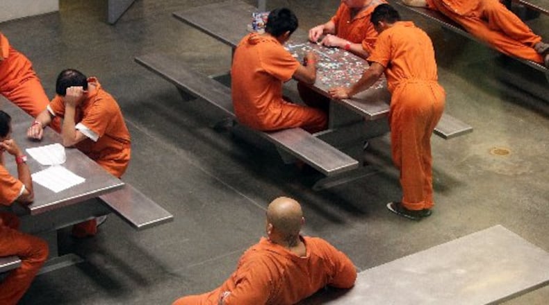 Detainees at the Irwin County Detention Center in Ocilla, putting together a puzzle on Thursday, April 19, 2012. Curtis Compton ccompton@ajc.com