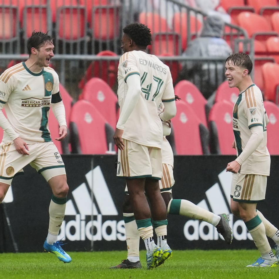 Atlanta United's Alexey Miranchuk (left) celebrates with teammates after scoring a goal against Toronto FC during the second half in Toronto on Saturday, April 25, 2026. (Frank Gunn/The Canadian Press via AP)