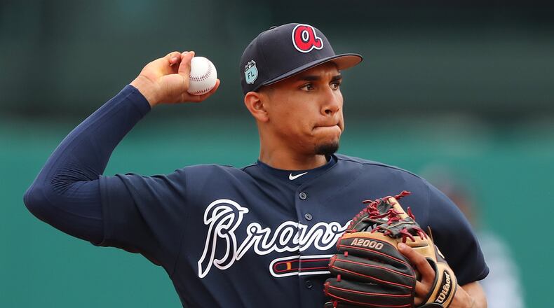 Braves infield prospect Johan Camargo was optioned to Triple-A Gwinnett on Thursday, one of seven players trimmed from the major league spring-training roster in the latest round of cuts. (Curtis Compton/ccompton@ajc.com)