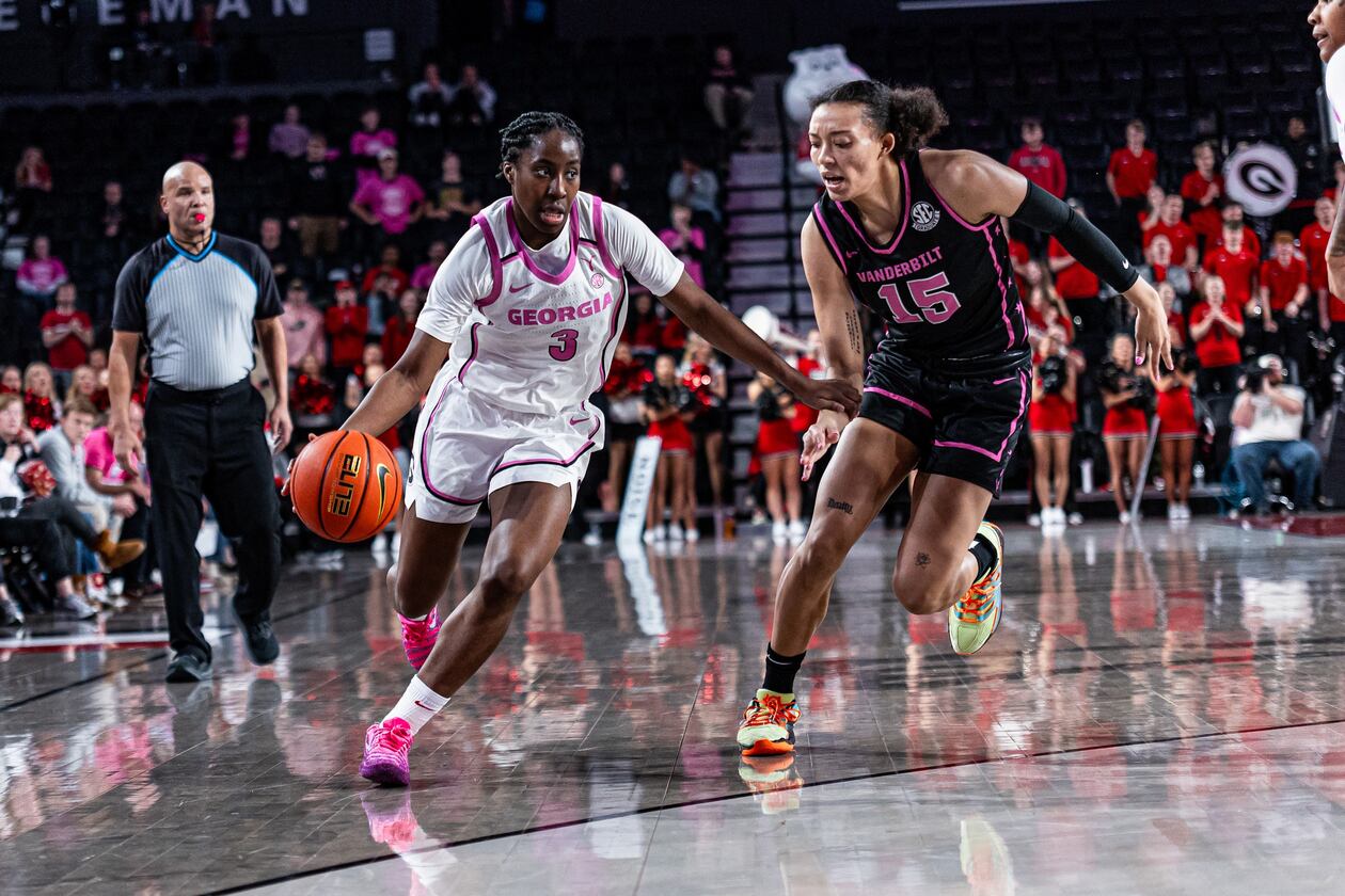 Georgia guard Dani Carnegie takes the ball around a Vanderbilt player Sunday. (Emil Madden/UGA Athletic Association)
