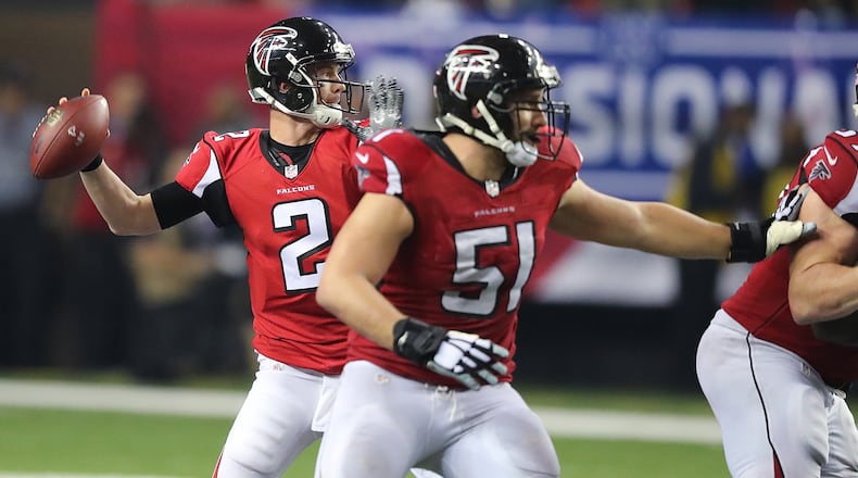 Falcons center Alex Mack gives Matt Ryan plenty of time to toss a first-down pass against the Seahawks last week. (Curtis Compton/ccompton@ajc.com)