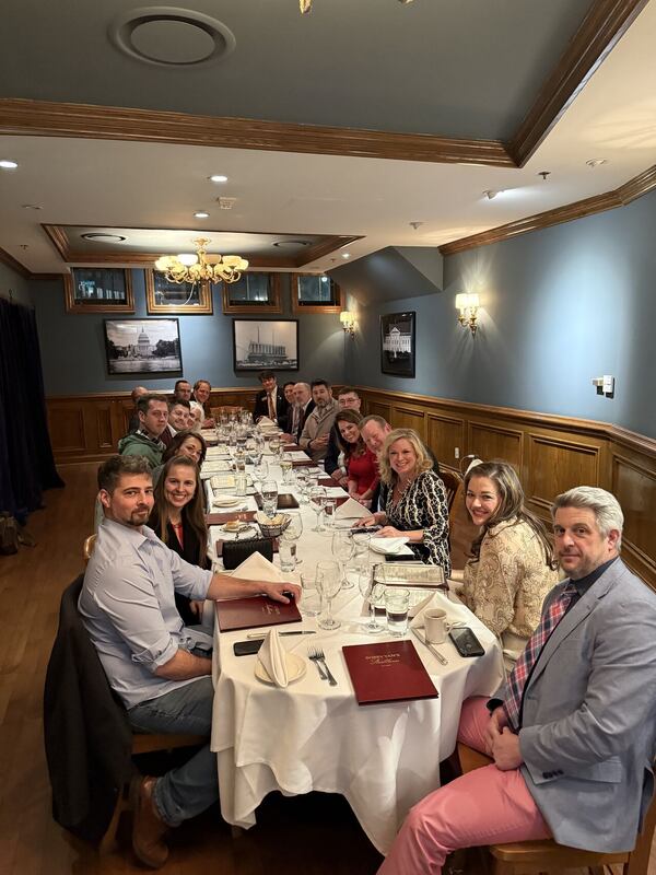 Dr. Rick Richards, eighth from right, was among the conservative activists and officials who attended the summit. Marci McCarthy, second from the right, posted about the event on LinkedIn. McCarthy later took down the post. (Screenshot)