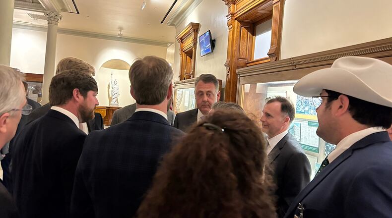 Senate Majority Leader Steve Gooch, R-Dahlonega, gets an earful from lobbyists Wednesday night. Gooch was one of the lawmakers who negotiated a compromise on House Bill 189, which would raise the maximum weight of trucks carrying some goods.