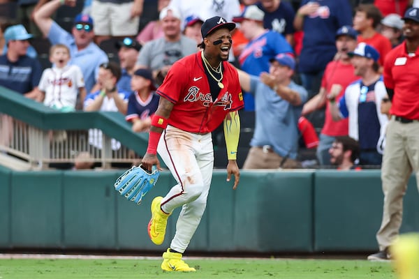 Atlanta Braves outfielder Ronald Acuña Jr. reacts after throwing out a runner at third base in the third inning of a baseball game against the New York Yankees, Friday, July 18, 2025, in Atlanta. (AP Photo/Colin Hubbard)