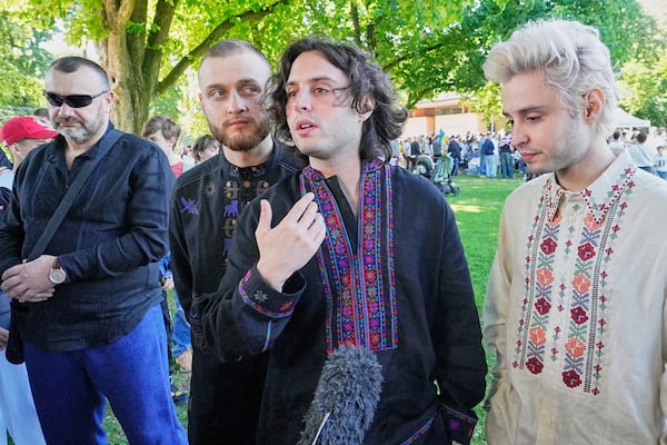 Eurovision competitor band Ziferblat from Ukraine gives an interview to the Associated Press during a family meeting of Ukrainian people in a park in Basel as part of the 69th Eurovision Song Contest week, in Basel, Switzerland, Thursday, May 15, 2025. (AP Photo/Martin Meissner)