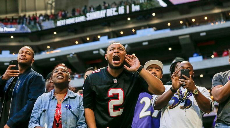 Falcons fans watch the team leave the field following a loss to the Baltimore Ravens at Mercedes-Benz Stadium on Dec. 2.