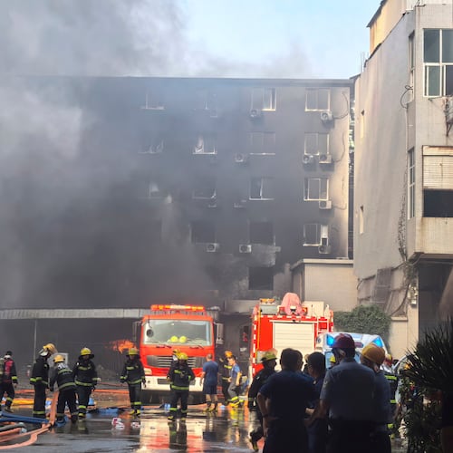 In this photo released by Xinhua News Agency, firefighters at the scene of a footwear factory fire in Jiangtou village, Chendai township of Jinjiang city, southeastern China's Fujian province, Thursday, July 9, 2026. (Zheng Liang/Xinhua via AP)