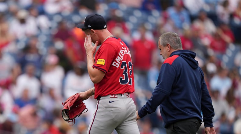 Atlanta Braves pitcher AJ Smith-Shawver walks to the dugout after being pulled during the third inning in the first baseball game of a doubleheader against the Philadelphia Phillies on Thursday. (Matt Slocum/AP)