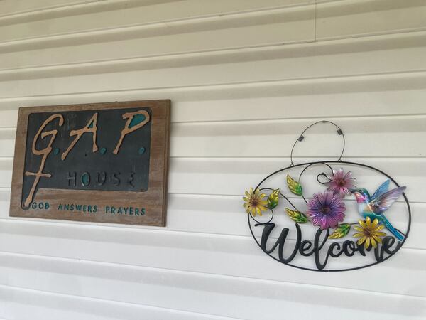 A "Welcome" sign at the entrance of a building on the rural campus of GAP House Ministries in Bryan County, Georgia on April 30, 2026. Flames from the Highway 82 wildfire came within a couple hundred yards of the nonprofit's buildings, forcing residents to evacuate. (Adam Van Brimmer/AJC)