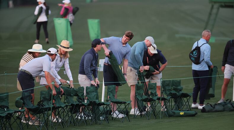 Patrons set chairs before first round at Masters golf tournament, at Augusta National Golf Club, Thursday, April 10, 2025, in Augusta, Ga. (Jason Getz / AJC)