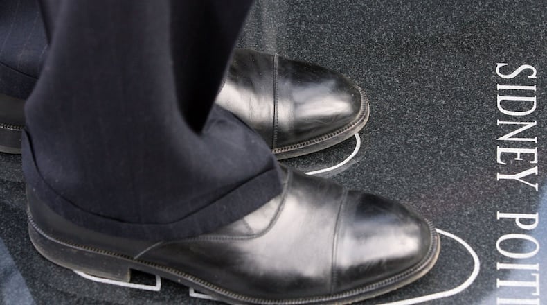Actor and director Sidney Poitier became emotional as he stepped into his footprints as part of the International Civil Rights Walk of Fame. AJC FILE PHOTO