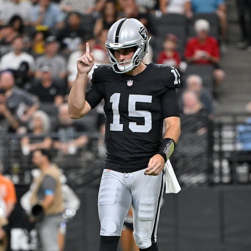 Las Vegas Raiders quarterback Fernando Mendoza (15) pauses on the field during the first half of a preseason NFL football game against the Arizona Cardinals, Thursday, Aug. 13, 2026, in Las Vegas. (AP Photo/David Becker)