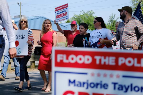 U.S. Rep. Marjorie Taylor Greene (red dress) campaigned for office in Rome in 2022. (Arvin Temkar/AJC)