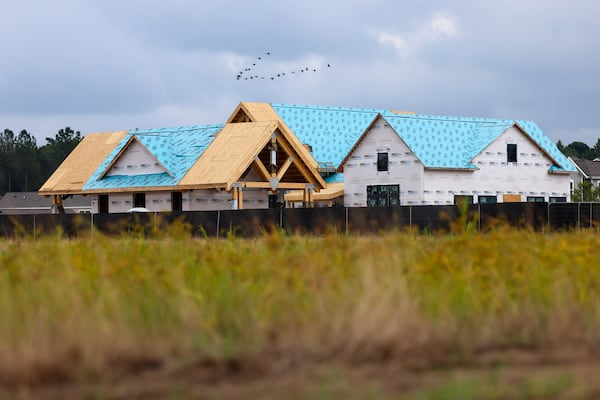 Birds fly over homes at Beacon Point at New Hampstead in Savannah on Aug. 1, 2026. (Arvin Temkar/AJC)