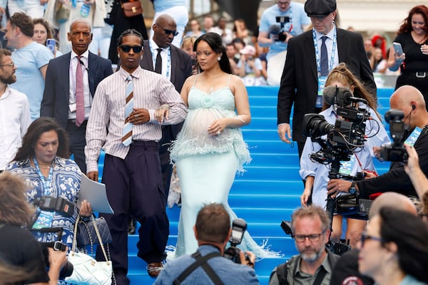 A$AP Rocky, left, and Rihanna arrive at the world premiere of the film "Smurfs", on Saturday, June 28, 2025, in Brussels. (AP Photo/Omar Havana).